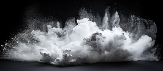 A white powder cloud dispersing in the atmosphere, creating a dynamic visual effect in the air