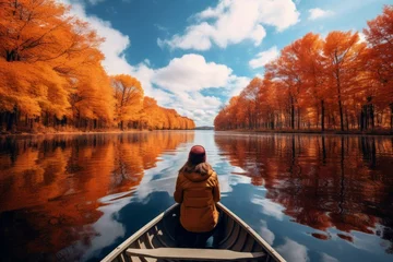 Papier Peint photo Lavable Brun Woman enjoying a peaceful boat ride on a calm lake