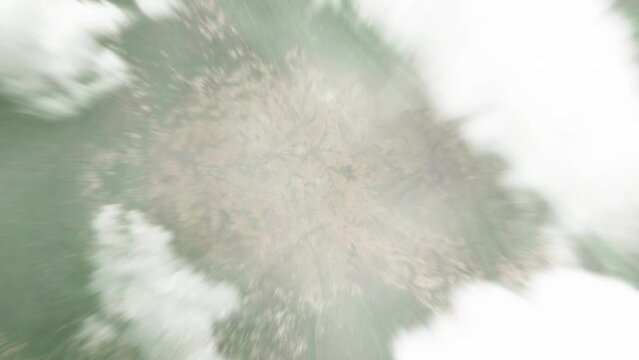 Earth zoom in from space to Kajo Keji, South Sudan. Followed by zoom out through clouds and atmosphere into space. Satellite view. Travel intro. Images from NASA