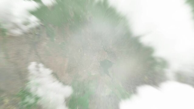 Earth zoom in from space to Moshi, Tanzania. Followed by zoom out through clouds and atmosphere into space. Satellite view. Travel intro. Images from NASA