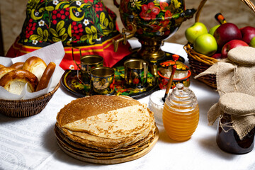 Pancakes with honey on the table in the Ukrainian  style