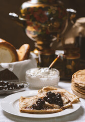 Pancakes with black currant jam on a plate, Ukrainian   style