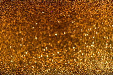Background sequin. glitter surfactant. Holiday abstract gold, glitter background with blinking...