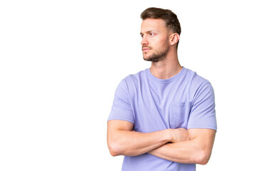 Fototapeta premium Young handsome caucasian man over isolated chroma key background looking to the side