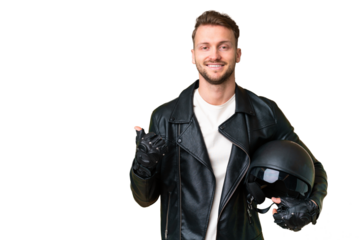 Young caucasian man with a motorcycle helmet over isolated chroma key background pointing to the side to present a product