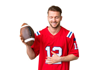 Young caucasian man playing rugby over isolated chroma key background smiling a lot