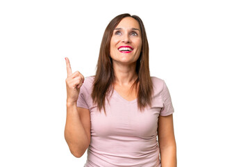 Middle-aged caucasian woman over isolated background pointing up and surprised