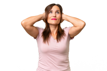 Middle-aged caucasian woman over isolated background frustrated and covering ears