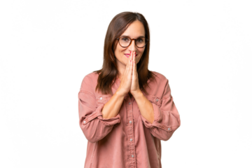 Middle-aged caucasian woman over isolated background keeps palm together. Person asks for something