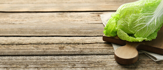 Fresh ripe Chinese cabbage on wooden table, space for text. Banner design - obrazy, fototapety, plakaty