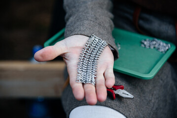 fragment of chain mail on hand
