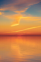 A beautiful minimalist scenery of a sunset at the Baltic sea. Colorful beach landscape of Northern Europe. - 771374598