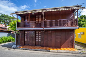 Deshaies, historic Caribbean wooden buildings on a street in Guadeloupe, Caribbean, French Antilles