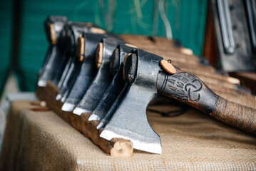 handmade axes in row