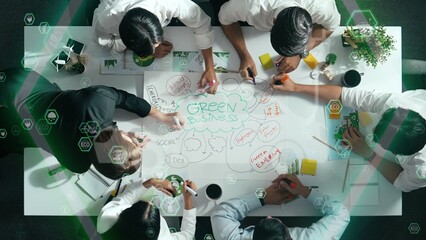 Top view of business team discussing about using clean energy and sustainable investment at meeting...