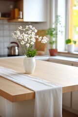 White flowers in a vase on a wooden table