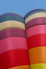 colorful hot air balloon closeup against blue sky