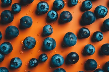 A cluster of blueberries in shades of orange and navy.