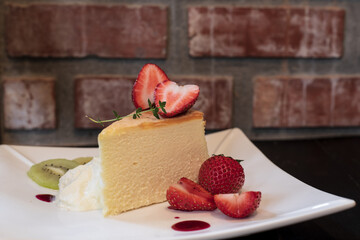 Japanese cheesecake and strawberry in the plate.