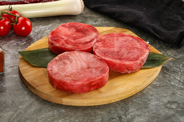 Delicous raw tuna medallion for cooking