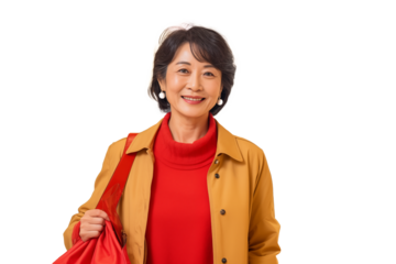 Middle aged Chinese woman with shopping bags on isolated chroma key background