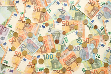 Many European euro money bills and coins. Lot of banknotes of European union currency close up