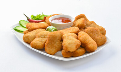 Chicken Nuggets. A chicken nugget is a food product consisting of a small piece of deboned chicken meat that is breaded or battered, then deep-fried or baked.