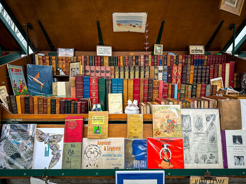 Paris, France - 19.02.2024. Second-hand Book Shop along River Seine in Paris. bouquiniste bookeller station at Quai des Grands Augustins street