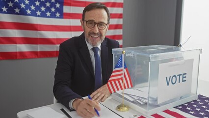 Mature businessman voting in american election with pen and ballot box in front of usa flag - Powered by Adobe