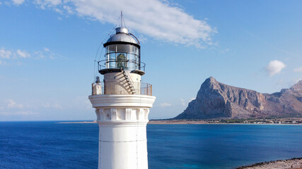 the coast of San Vito Lo Capo with the white lighthouse tower in the foreground