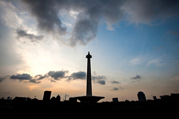 Silhouette of the National Monument (Monas), the most historic and famous landmark in Jakarta, the...