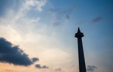 Fotobehang Silhouette of the National Monument (Monas), the most historic and famous landmark in Jakarta, the capital of Indonesia. © Sony Herdiana