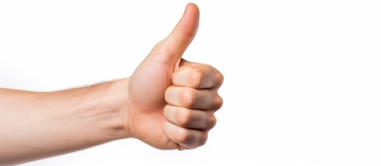A hand with a thumbs up gesture is shown on a white background, displaying the extended thumb and a slightly bent wrist. The nail and flesh of the hand are visible, with no wrinkles on the skin