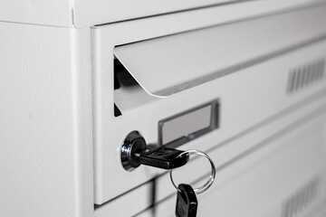 Fragment of the door of metal lockers for locker room. Change room metal locker box on the white background isolated.