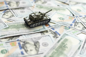 tank against the background of dollars. Concept of war.