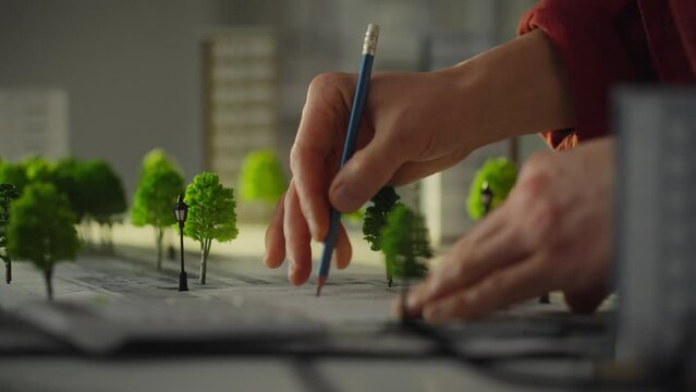 A white man is looking for the right house placement option. Construction engineer brainstorming the creation of a comfortable residential area sustainable development of urban development