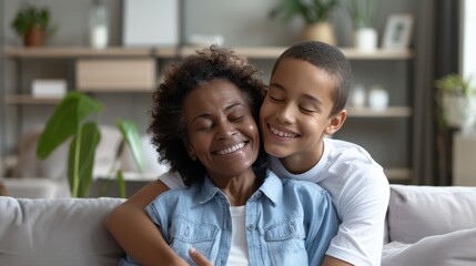 Joyful African American grandmother and grandson hugging, love and family concept - obrazy, fototapety, plakaty