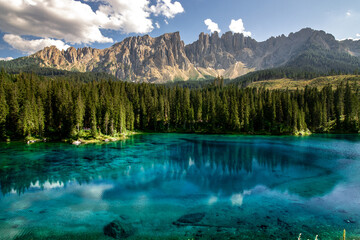 Carezza Lake. Beautifull blue lake in the Dolomites of Trentino Alto Adige, Nova Levante. Paradise landscape at Karersee with mountain Latemar. Italy.