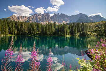 Carezza Lake. Beautifull blue lake in the Dolomites of Trentino Alto Adige, Nova Levante. Paradise landscape at Karersee with mountain Latemar. Italy. - obrazy, fototapety, plakaty