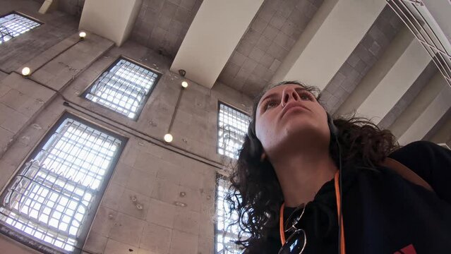 Female tourist visiting interior of the Alcatraz Island in San Francisco. The Alcatraz island was a federal prison from 1933 until 1963.