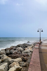 Obraz premium Sea storm on wharf in Torremolinos, Spain