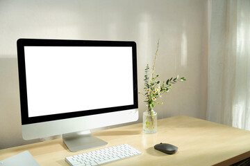 Mockup desktop computer, eucalyptus leaves, plant and Workspace and blank screen, copy space - obrazy, fototapety, plakaty