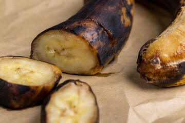 an overripe dark banana that is spoiling