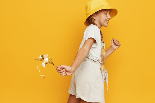 Young Woman In Summer Outfit With Windmill Toy