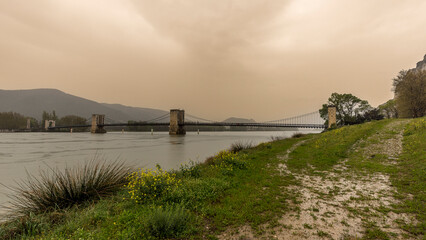 Robinet bridge on the Rhone one morning with a shower of Saharan sand