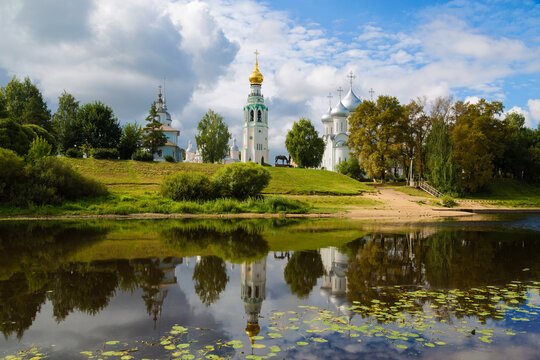 View of the architectural ensemble of the Kremlin Square from the Vologda River and its reflection in the water. Vologda, Russia