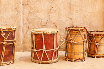 Vintage wooden drums over old wall background. Traditional mediterranean musical instrument - 771498394