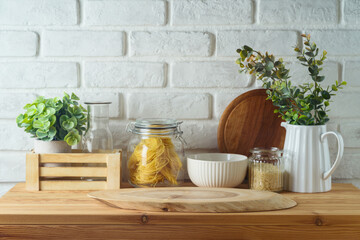 Empty wooden log  on kitchen table over white brick wall  background.  Kitchen mock up for design...
