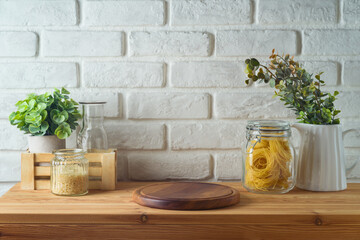 Empty wooden log  on kitchen table over white brick wall  background.  Kitchen mock up for design and product display.