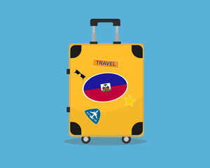 Suitcase or baggage with Haiti flag, holiday and vacation idea